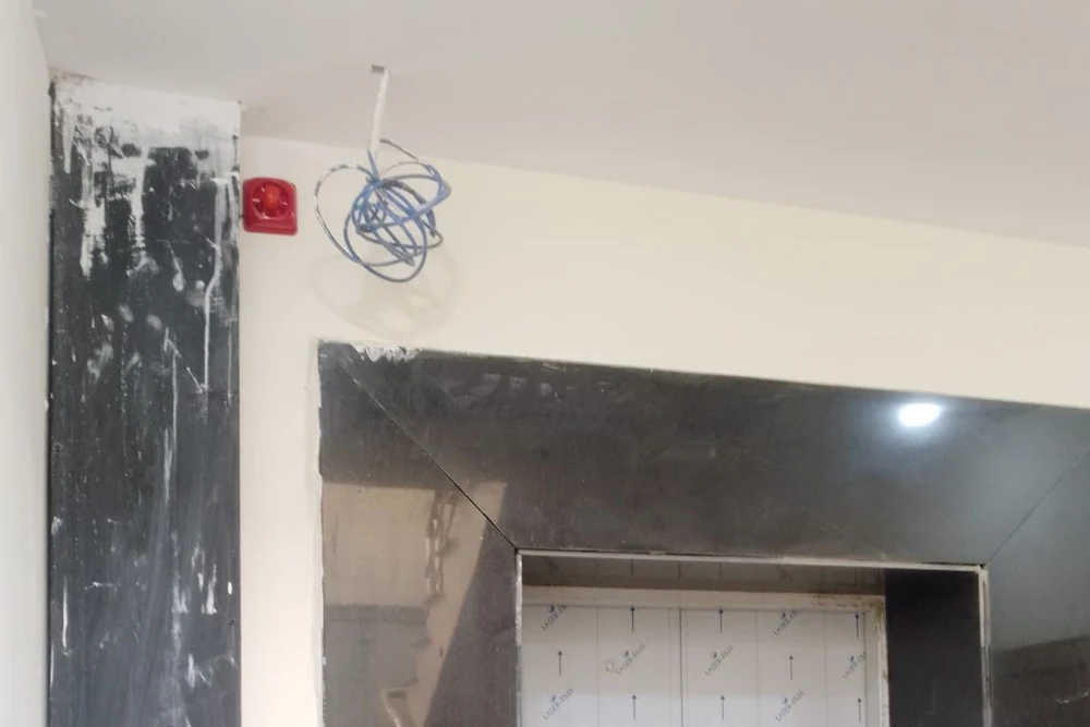 Fire alarm sounder installed on wall near ceiling by HIFAZAT in Lahore