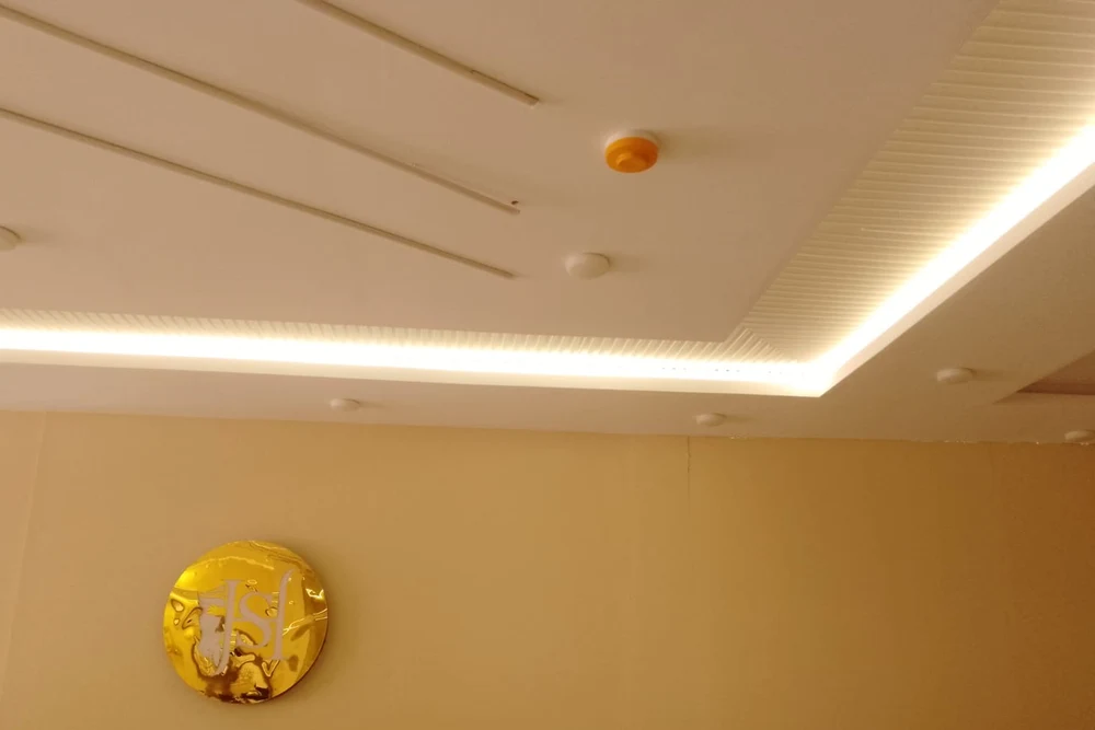 Ceiling-mounted smoke detector installed by HIFAZAT in a Lahore commercial ceiling